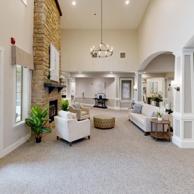 Settle into comfort at Walnut Creek Assisted Living & Memory Care a large living room with white walls