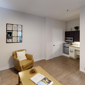 Refined spaces to match your style a living room with a couch and a table